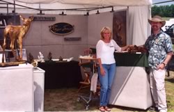 Roger and Vicki Smith in front of display booth at the Michigan Magazine Art Show.
